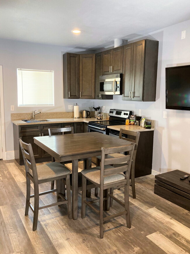 Full kitchen with dining area - 1026 W 168th St