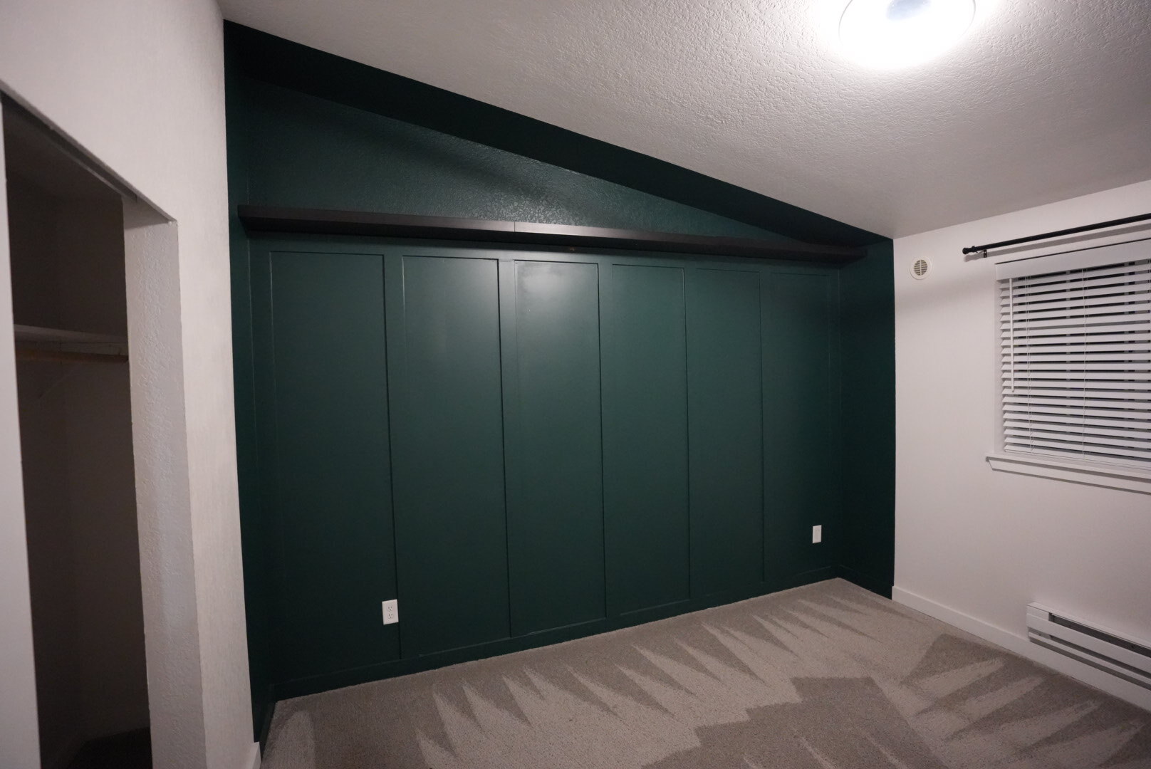White walls with green accent and shelf - 23410 18th Ave S