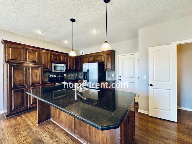 Building Photo - Gorgeous Olathe, 5 BR Home w/ Wood floors,...