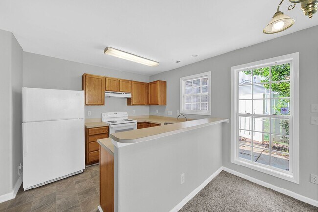 Building Photo - Two-story Condominium with Easy Highway Ac...
