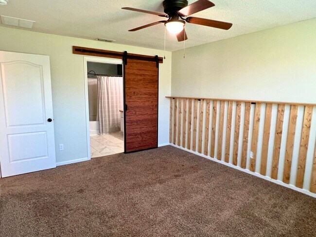 Building Photo - Stylish 4-Bedroom Home with Fenced Yard – ...