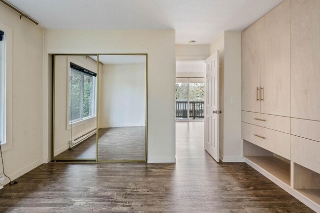 Building Photo - $500 off! Spacious 1-bdrm/1-bath condo in quiet neighborhood. Balcony, 2 parking spaces, fireplac...