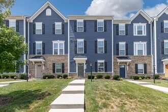 Building Photo - Luxurious three-story townhome with owner's suite and high-end finishes
