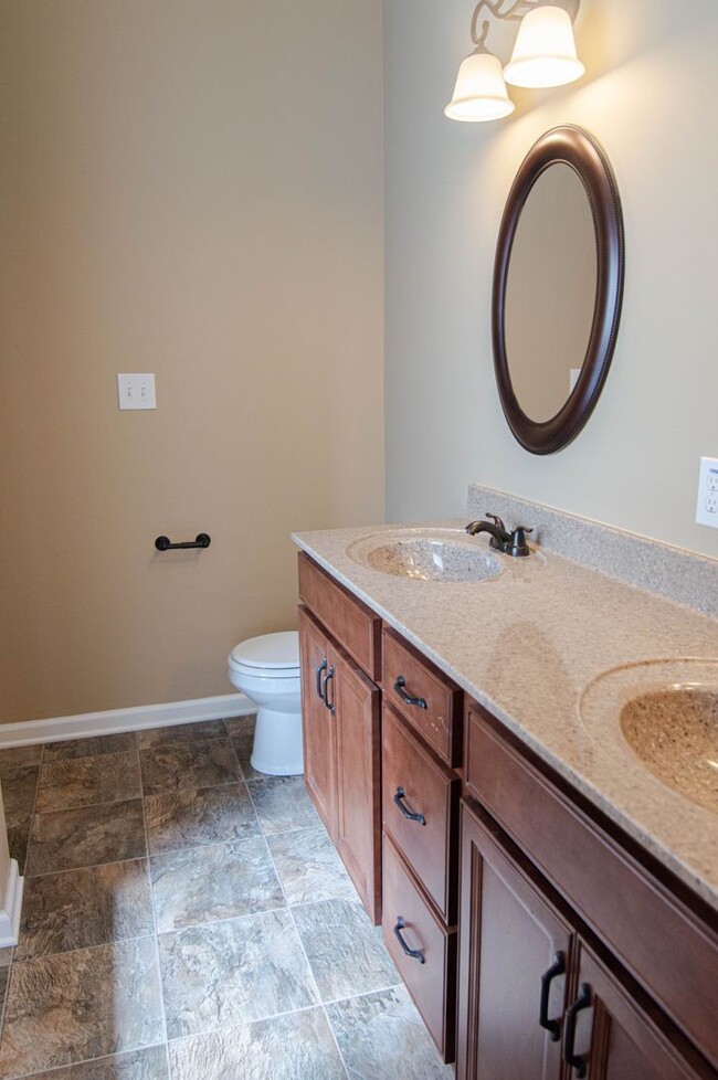 Building Photo - Pet Friendly Three Bedroom with Bonus!