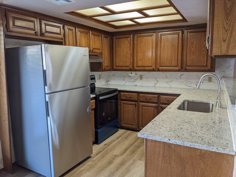 Kitchen with Brand New Granite counter tops and appliances - 1616 Julie Plz
