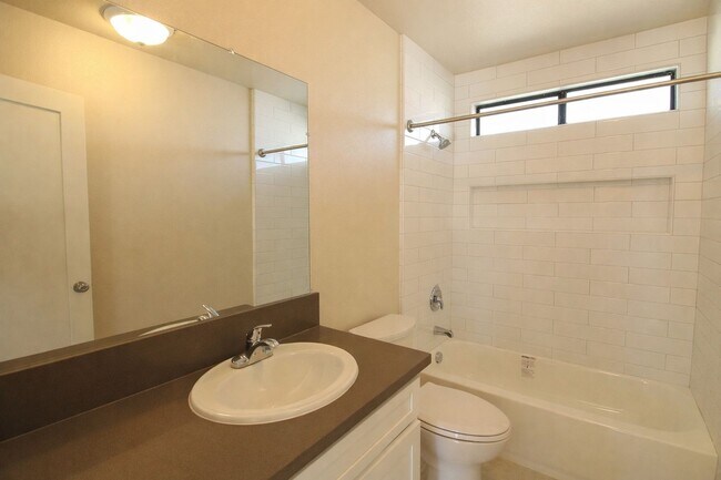 Building Photo - Recently Renovated, Single-Level 2-Bedroom Apartment with Small Fenced Yard.