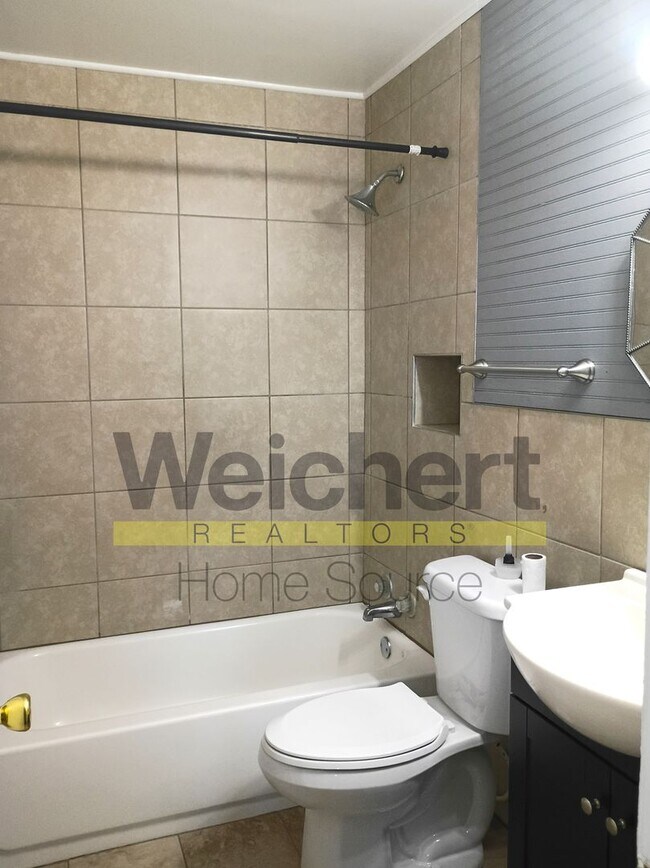 Building Photo - Quality finishes and adaptable design in a...