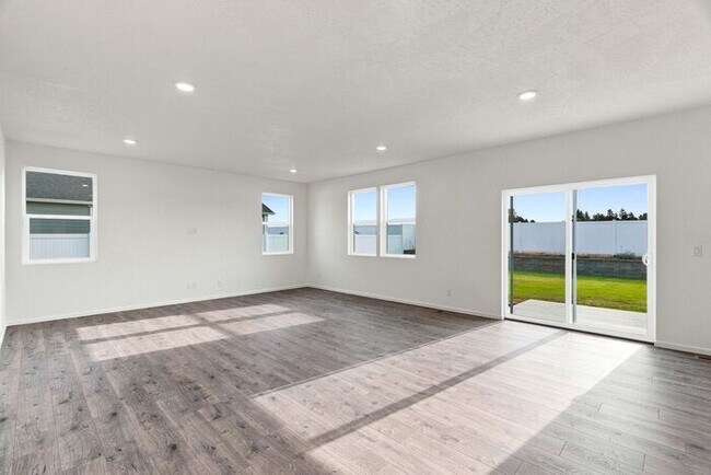 Building Photo - Spacious 5-Bedroom with Loft with 3-Car Garage