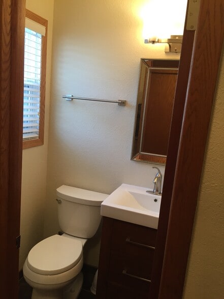 1/2 Bath (upstairs off Laundry and Rear Entry) - 521 6th Avenue Northeast