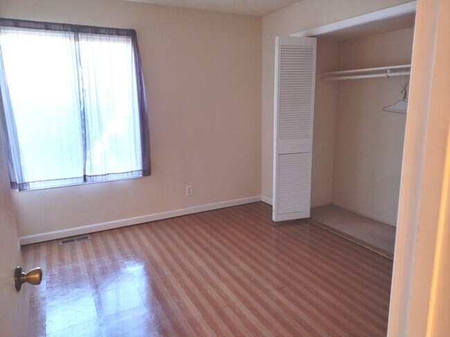 bedroom with large closet - 5450 Concord Blvd