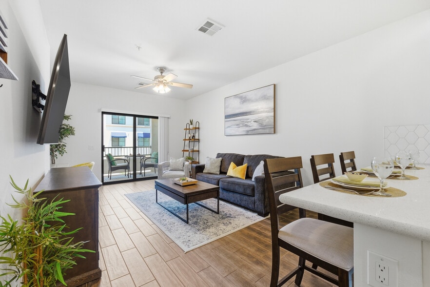 Relax and unwind in this beautifully furnished living area. - 2511 W Queen Creek Rd