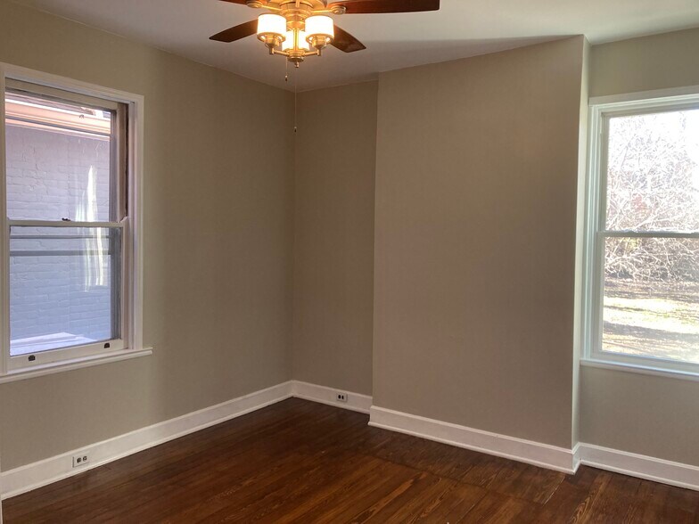 Bedroom has two large windows. - 2221 Oakland Ave, Apt A