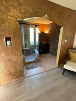 Zen style bathroom with rock wall - 163 California Ave