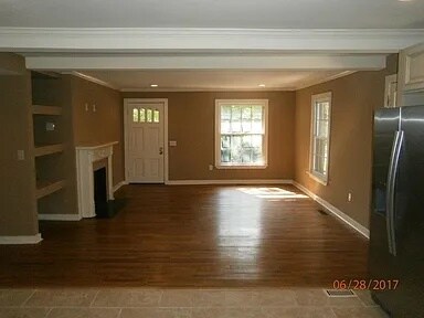Family room with orginial hardwood floors! - 709 S Dickerson Rd