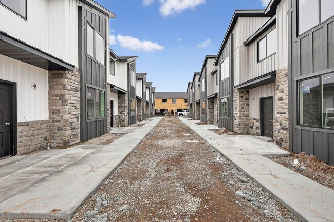 Building Photo - $300 off first month for February move-ins - BRAND NEW 3 BED 2.5 BATH TOWNHOMES WITH 2 CAR GARAGE