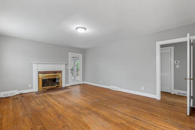 Building Photo - Brick home, Two Story, Hardwoods, DR, 2 Sun Rooms, FP, Carport!.