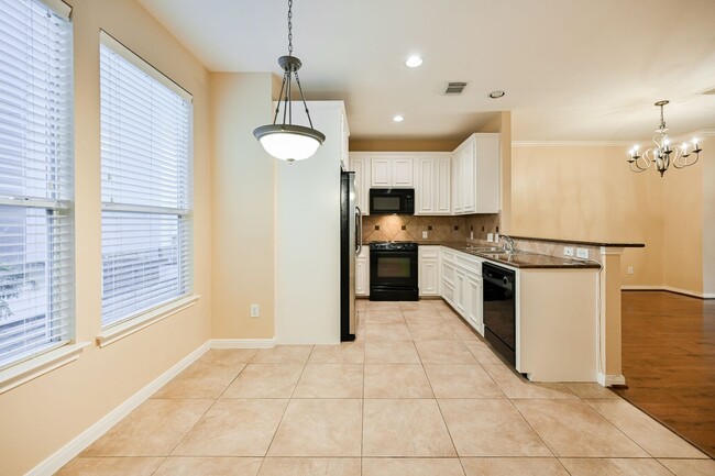 Building Photo - Gorgeous and spacious three-story townhome!