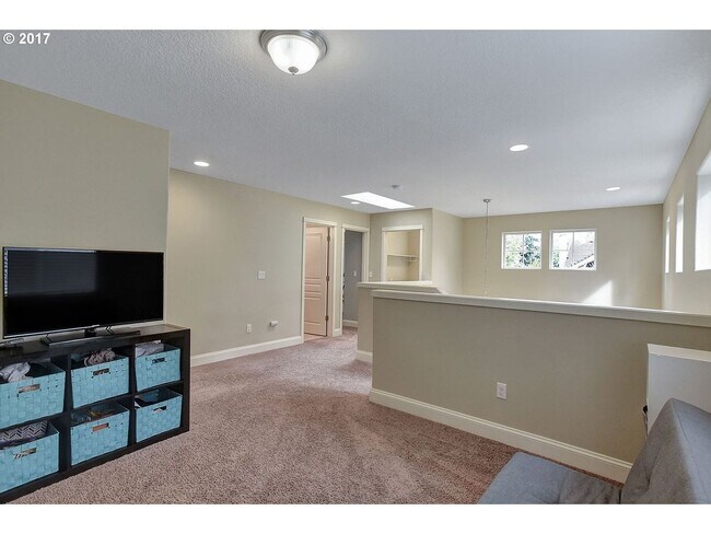 Building Photo - Bright and Open Floor Plan with Fireplace, Attached Garage & Vaulted Ceilings