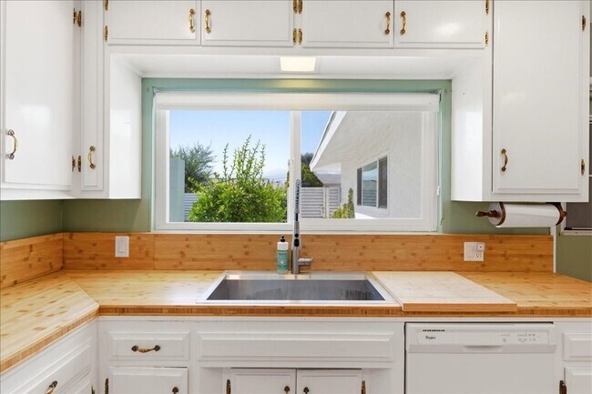Building Photo - 3 bed / 2 Bath Mid-Century Home with Two-Car Garage, Soaking Pool and Manicured Backyard!