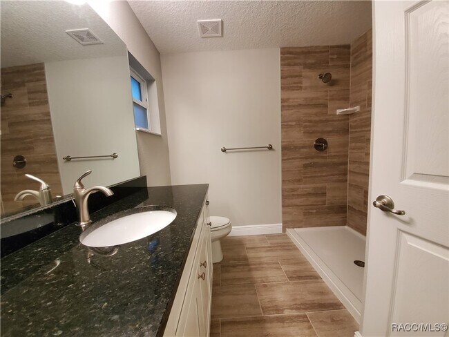 Building Photo - 8687 N Paradisea Dr