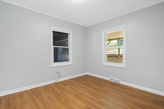 Building Photo - Modest East Asheville 3-Bedroom with Garage & Fenced-In Backyard