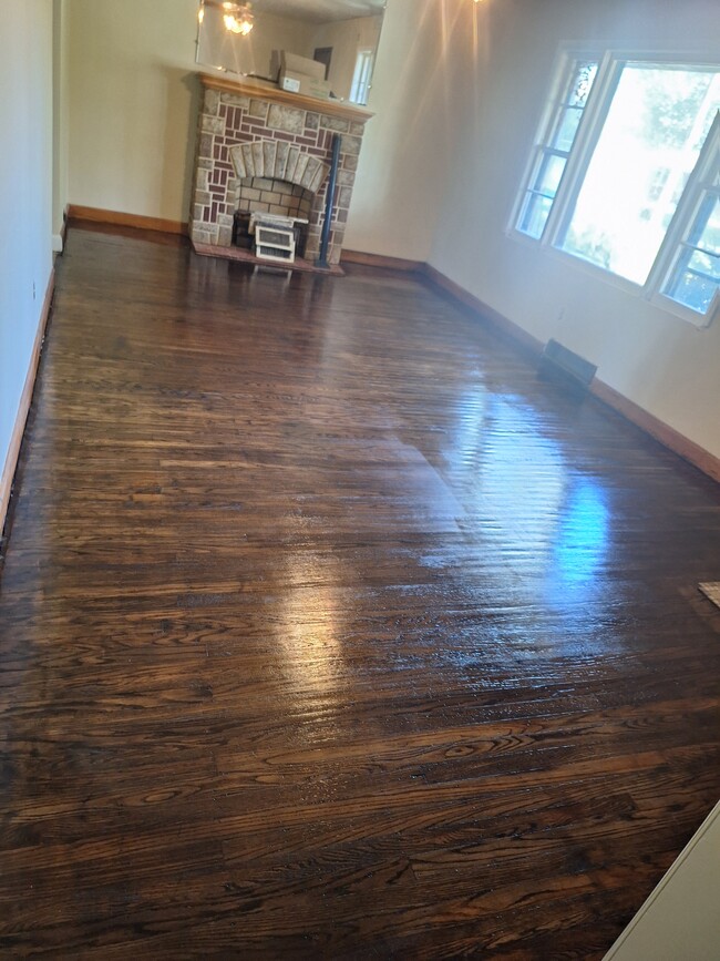 Living Room refinished floors - 4798 Westside Dr