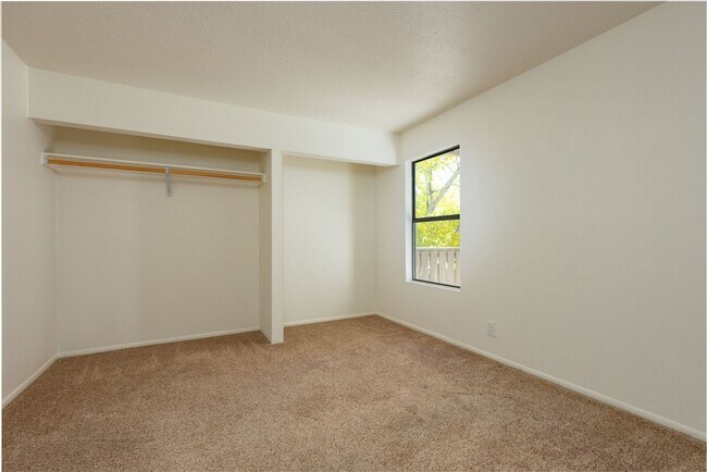 Building Photo - Light and Bright Second Level Condo Available Now!