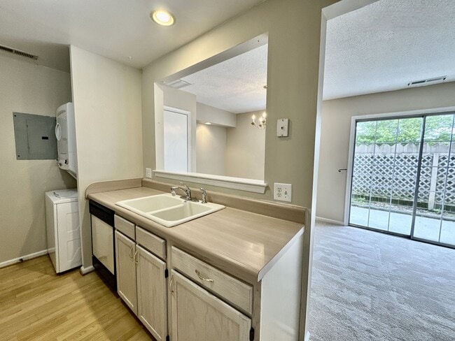 Building Photo - Available 06-15-25! End-Unit Condo w/2 Pri...