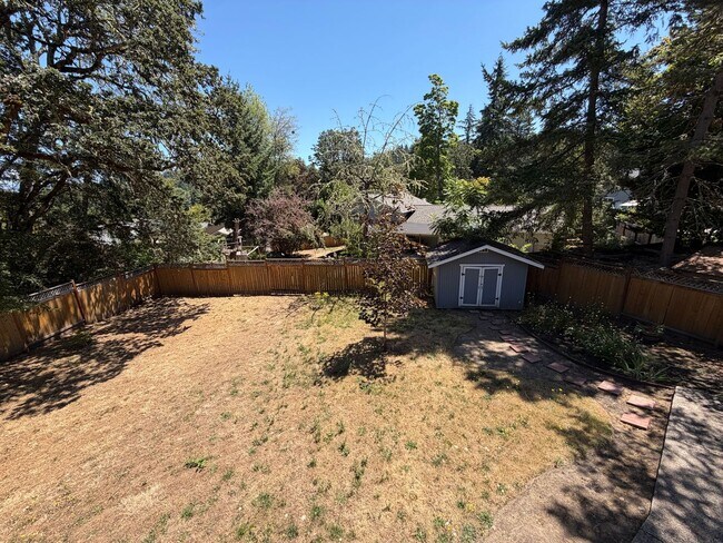 Building Photo - Spacious 4BR/3BA Home with Deck, Fenced Yard & Garage
