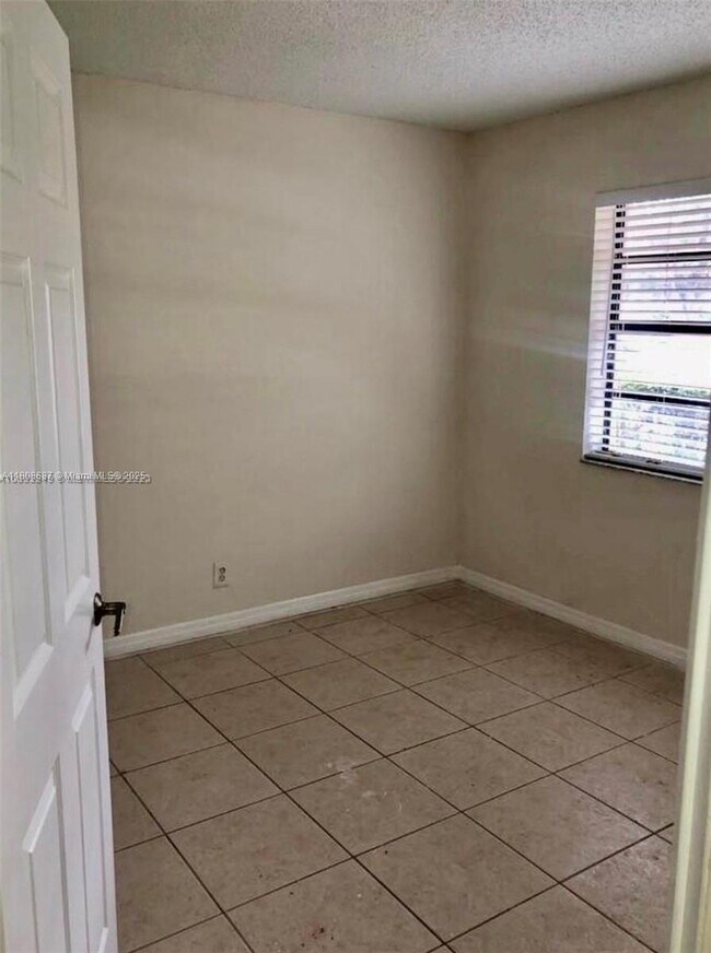 Building Photo - 11213 Royal Palm Blvd