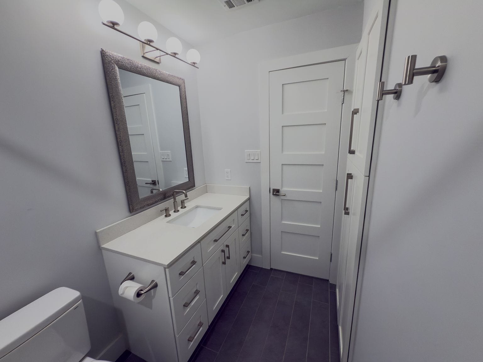 Bathroom vanity with framed mirror and tub/shower combo - 2006 Candle Ct
