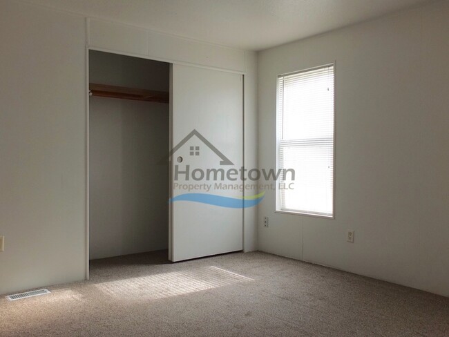 Building Photo - 2 Bed 1 Bath Mobile with Fenced Yard and Storage Shed!