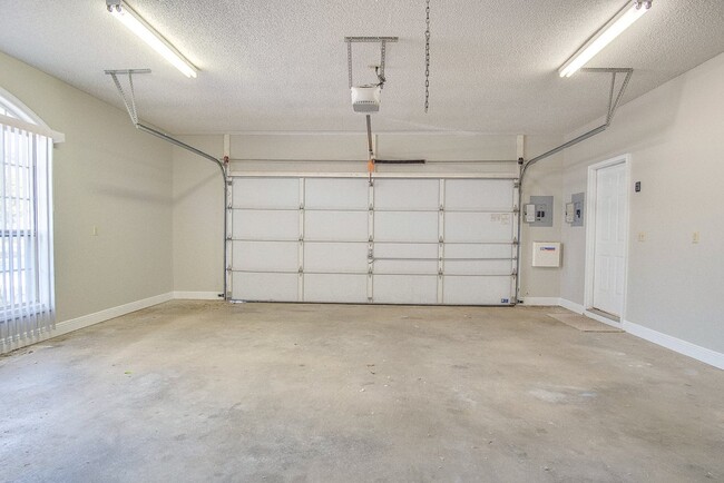 Building Photo - Festive Move-In Special! 4BR/3BA Lenox Gem – Fully Fenced Backyard & Military ½ Deposit