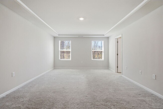 Building Photo - Upgraded 3BR Townhome in Wake Forest | Open Layout, Garage & Resort-Style Amenities