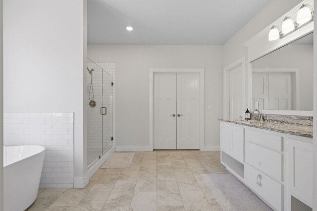 Building Photo - Stunner! This beautiful home features a spacious open floor plan with primary suite and private o...