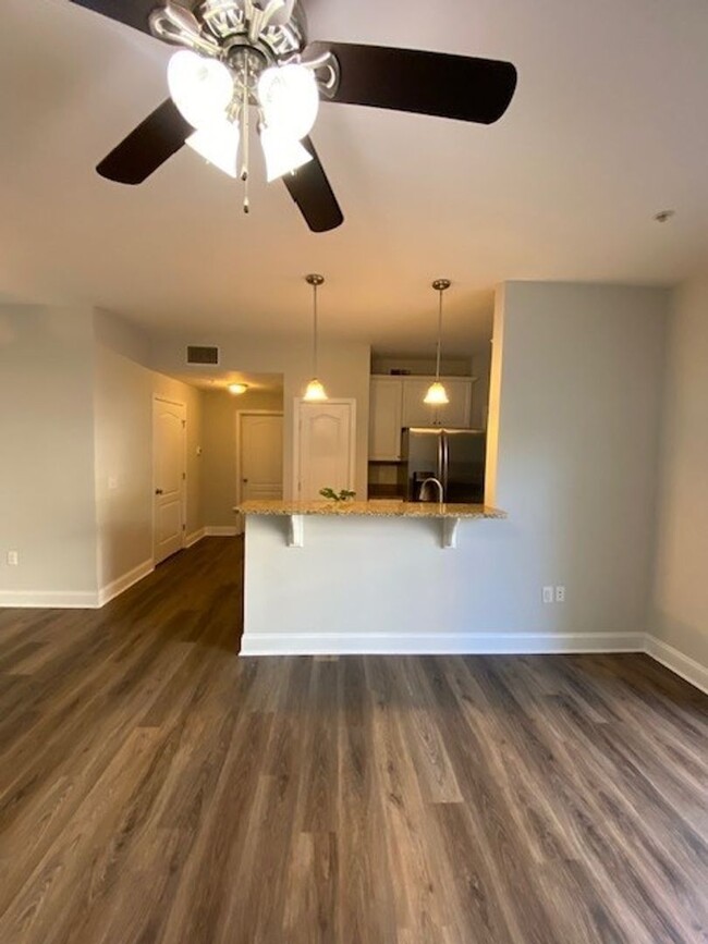 Building Photo - Welcome to this stunning 1st floor condo l...