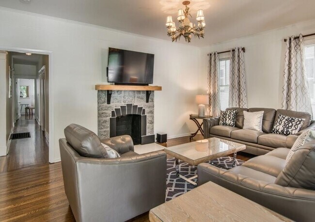 Building Photo - Welcome home to this stunning FULLY FURNISHED and AMPLE FREE PARKING for at least six cars!