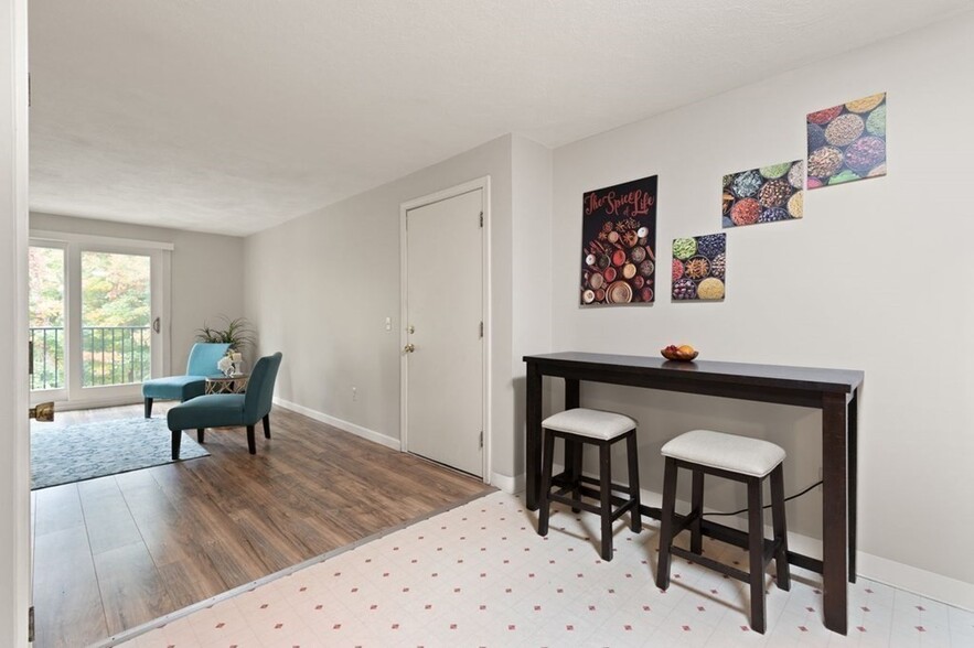 Living room and kitchen, new flooring, baseboard, and paint - 9 Kenmar Dr