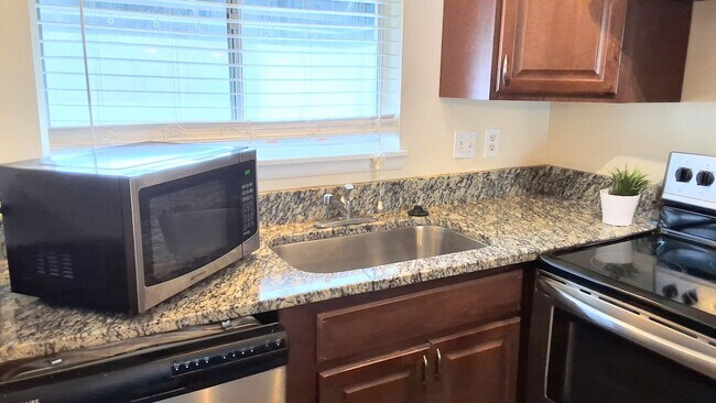 Building Photo - Stunning all remodeled 2/1.5 condo with Am...