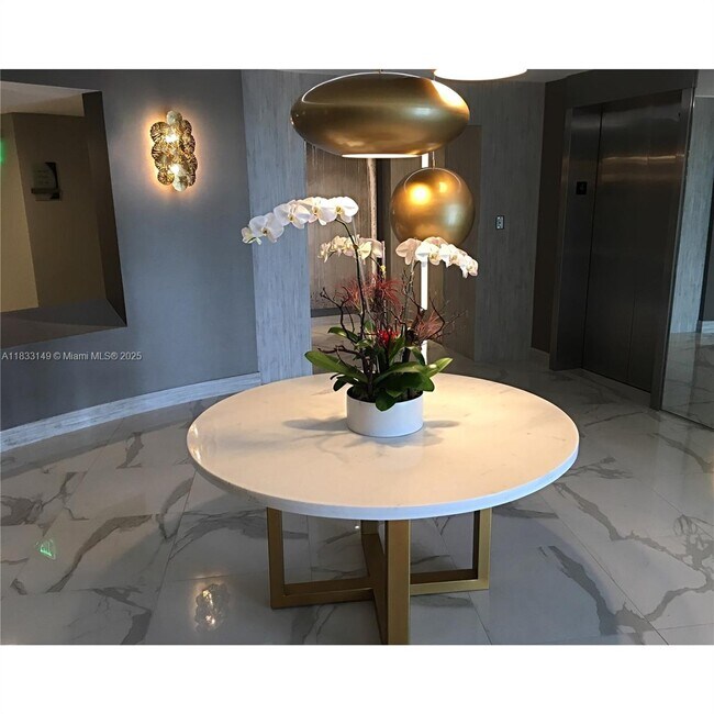 Building Photo - 10275 Collins Ave