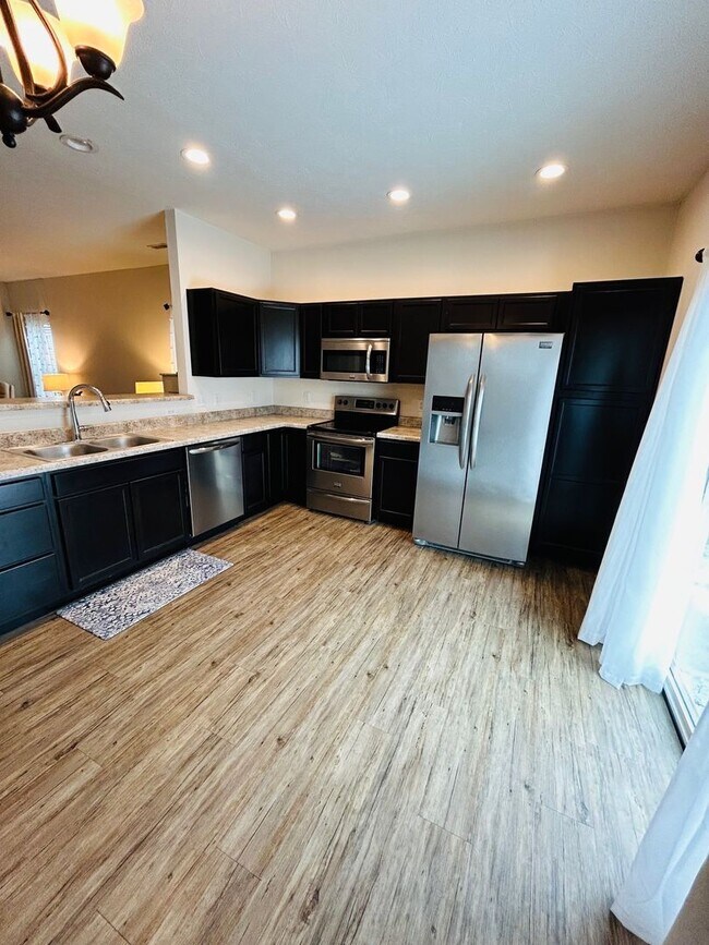 Building Photo - House with Fenced Backyard