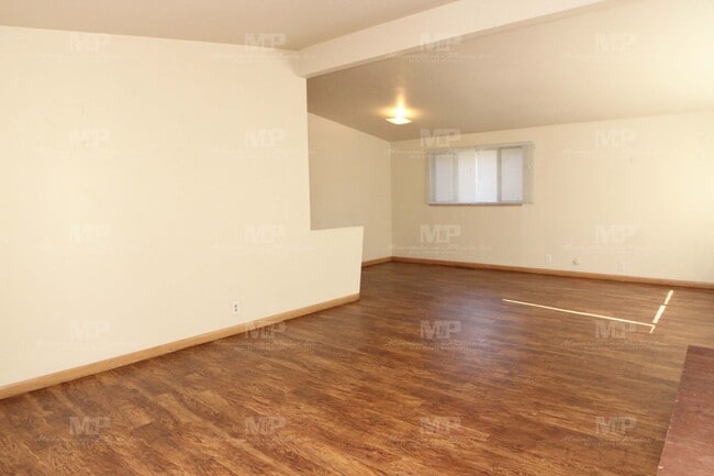 Building Photo - Three Bedroom with Covered Parking Spot!