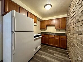 Building Photo - Awesome One Bedroom Apartment! Exposed Bri...