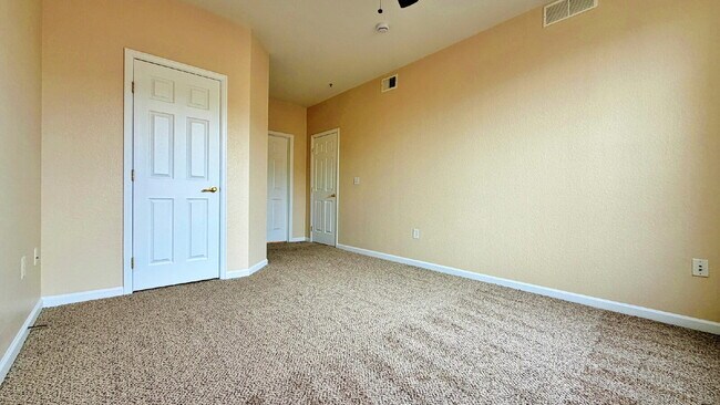 Building Photo - NEW CARPET NEW PAINT!! Clean and Bright 2BR 2BTH Condo Close To DIA. Gated Community in First Cre...
