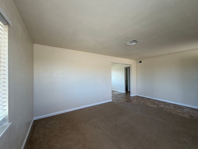 Building Photo - 3 Bedroom 2 Bathroom House with Central A/C , 2 Car Garage and Beautiful Backyard with Covered Patio