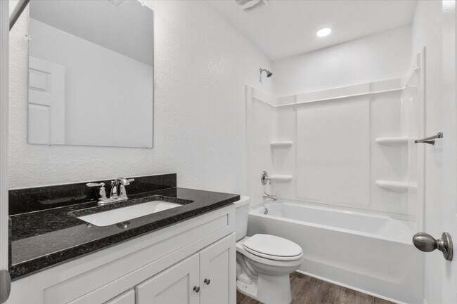 Building Photo - Spacious 4-Bedroom Townhome