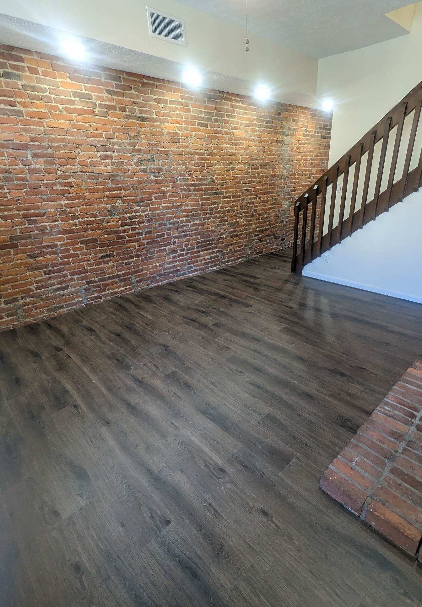 Living room w/ new LVP throughout - 1619 Mansfield St