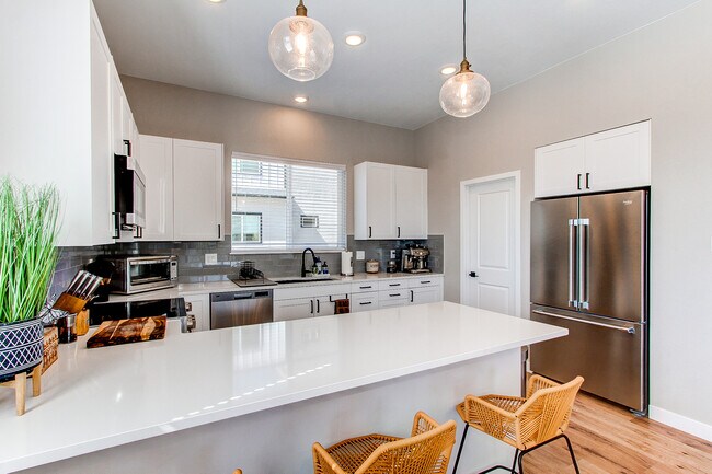Kitchen with stainless steel appliances - 8500 W 62nd Ave