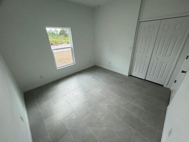 Building Photo - NEW CONSTRUCTION-  Modern 2 Bed / 2 Bath Home in South Lehigh Acres