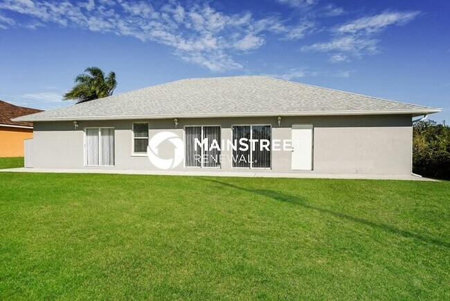 Building Photo - 4 Bedroom Pet-Friendly Home in LEHIGH ACRES, FL with Main Street Renewal